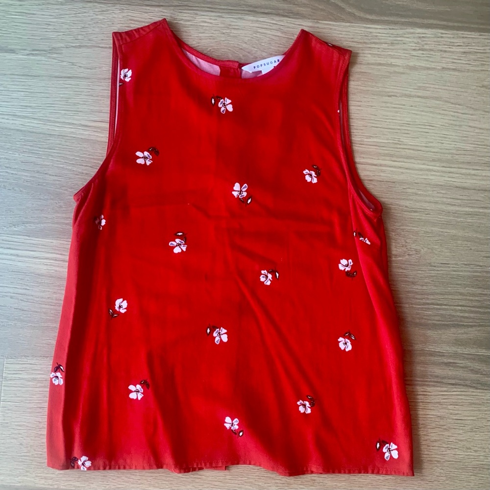 Red floral sleeveless blouse